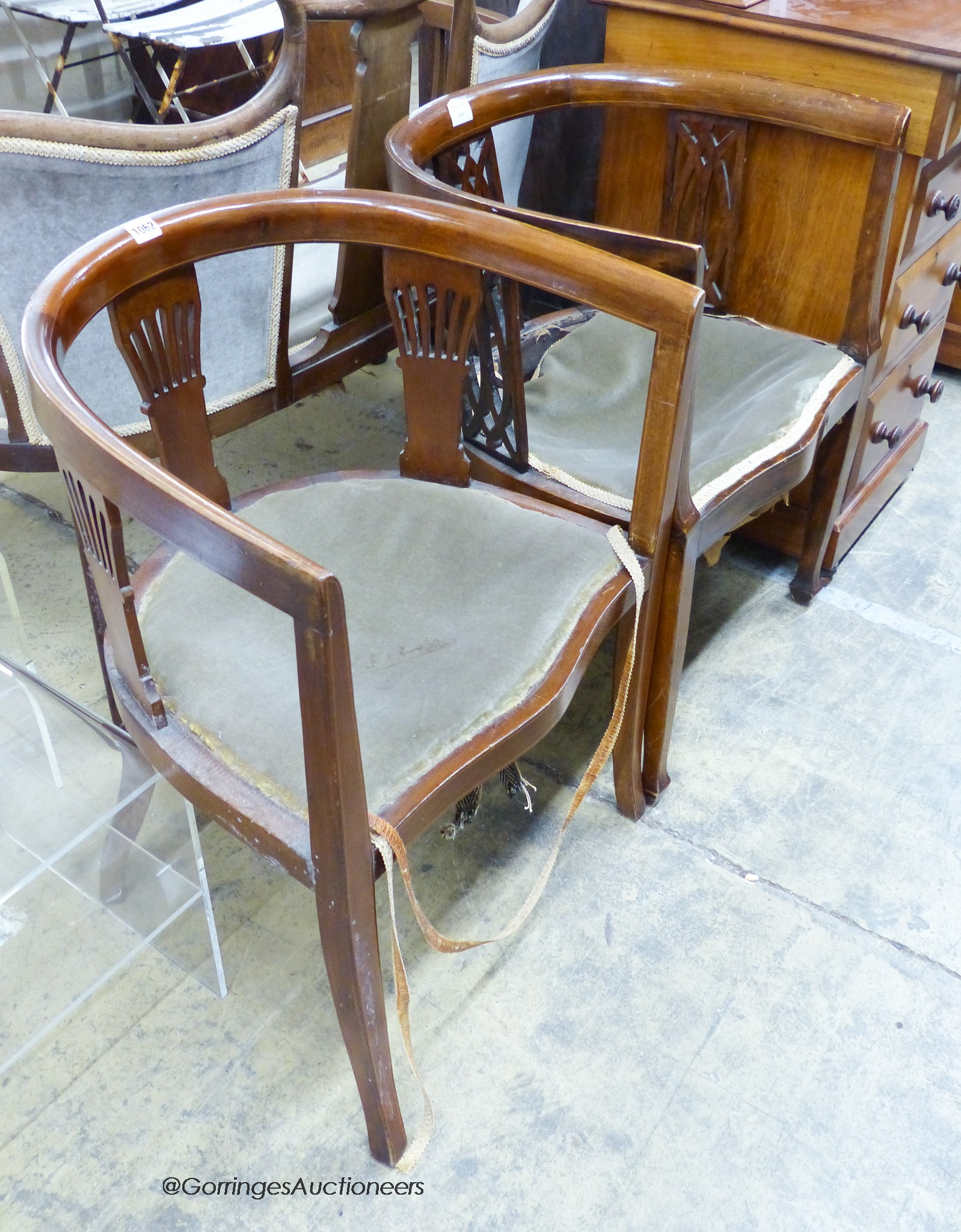 Two Edwardian mahogany tub frame salon chairs
